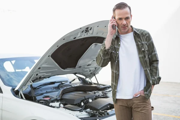 Desperate man calling for assistance after breaking down — Stock Photo, Image