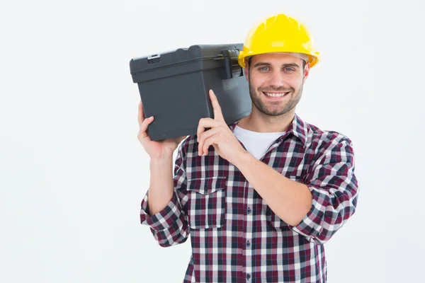 Homem reparador carregando caixa de ferramentas no ombro — Fotografia de Stock