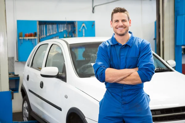 Mechanic smiling at the camera — Stock Photo, Image