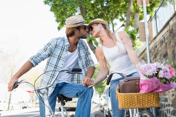 Attractive couple on a bike ride — Stock Photo, Image