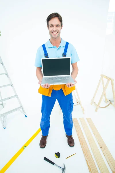 Repairman holding laptop — Stock Photo, Image