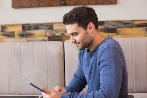 Young man using his tablet pc — Stock Photo, Image