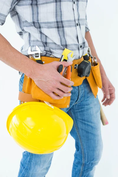Technician with tool belt and hard hat — Stock Photo, Image