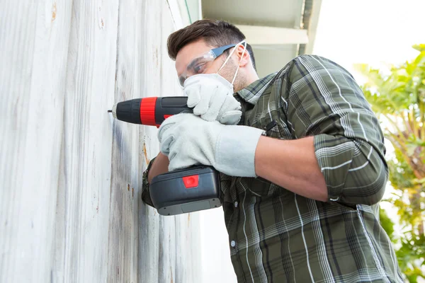 Carpenter using drill machine — Stock Photo, Image