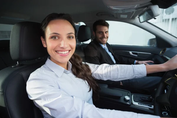 Business team smiling at the camera — Stock Photo, Image