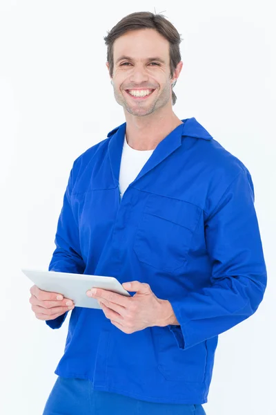 Handsome mechanic holding digital tablet — Stock Photo, Image