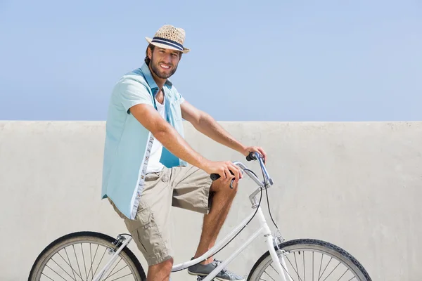 Handsome man on a bike ride — Stock Photo, Image