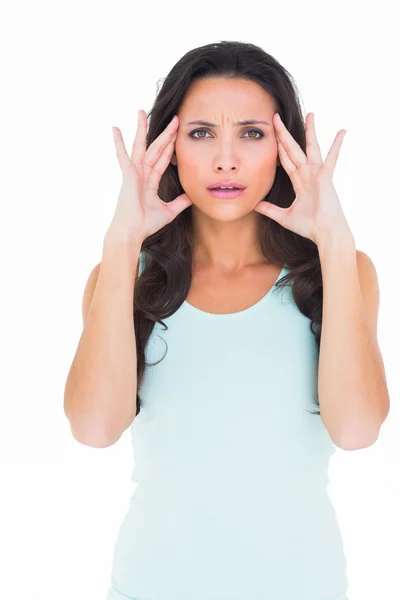 Pretty brunette with a headache — Stock Photo, Image