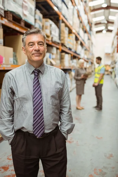 Cheerful businessman with hands in pocket — Stock Photo, Image