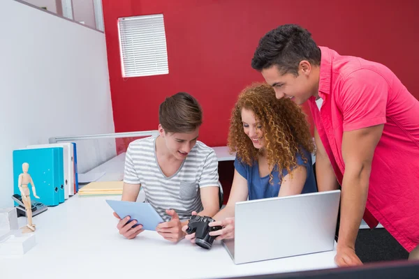 Students working with camera and tablet — Stock Photo, Image