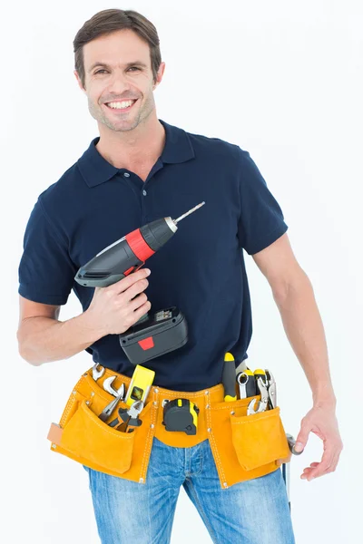 Carpenter holding portable drill machine — Stock Photo, Image