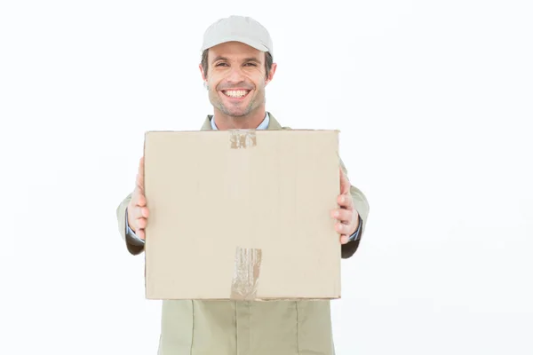 Happy delivery man carrying parcel — Stock Photo, Image