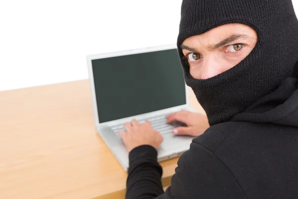 Hacker using laptop to steal identity — Stock Photo, Image