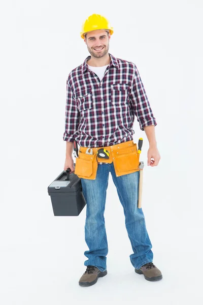 Happy male hanyman carrying toolbox — Stock Photo, Image