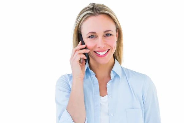Pretty blonde smiling on the phone Royalty Free Stock Images