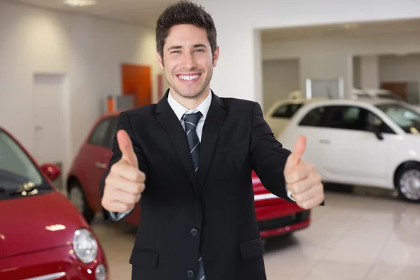 Businessman giving thumbs up Stock Image