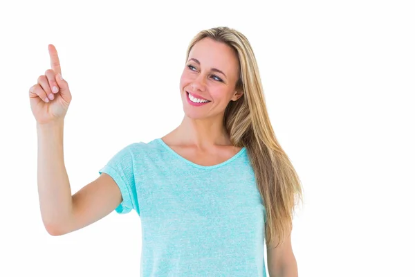 Smiling blonde pointing up Stock Image