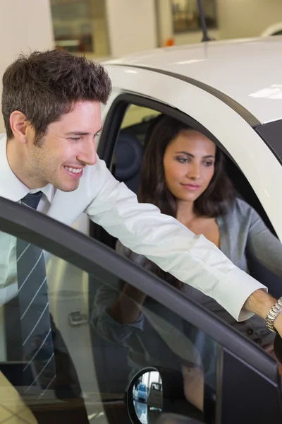 Businessman showing something to customer Stock Picture