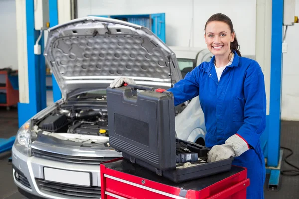 Mechanic smiling at the camera Stock Picture