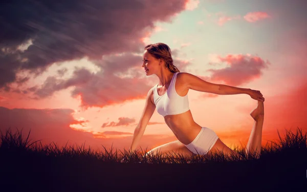 Fit blonde in seated yoga pose — Stock Photo, Image