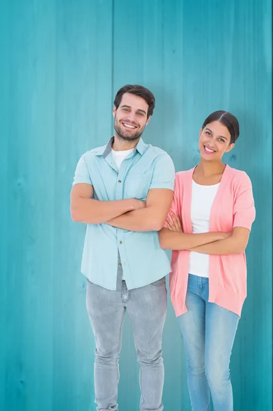 Happy couple with arms crossed — Stock Photo, Image