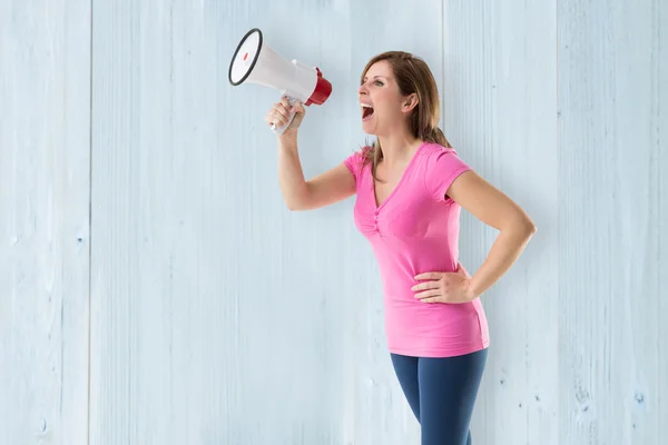 Angry woman with megaphone — Stock Photo, Image