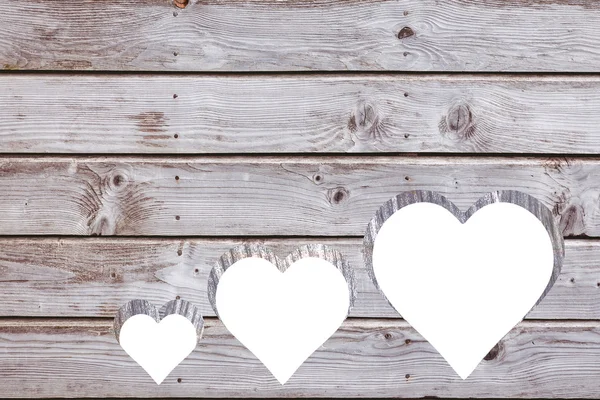 Hearts cut out in wood — Stock Photo, Image