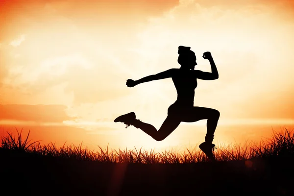 Woman running and jumping — Stock Photo, Image