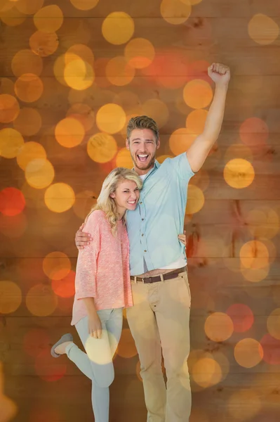 Attractive couple smiling and cheering — Stock Photo, Image