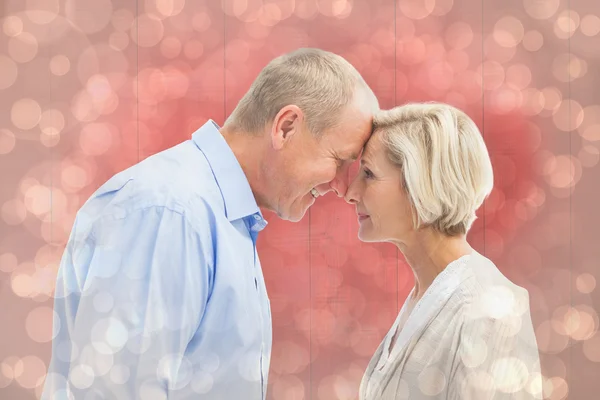 Happy mature couple facing each other — Stock Photo, Image