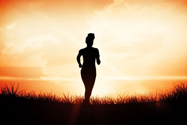 Woman jogging away from camera — Stock Photo, Image