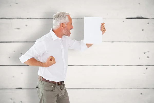 Angry man shouting at piece of paper — Stock Photo, Image