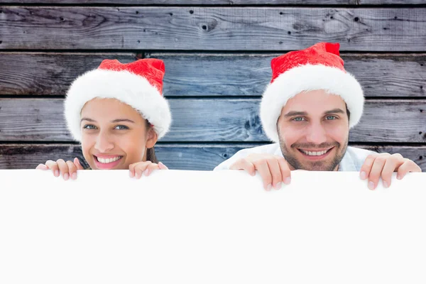 Couple against grey wooden planks — Stock Photo, Image