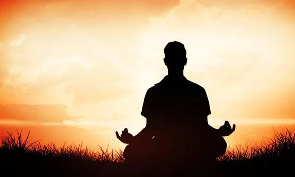 Man meditating in lotus pose — Stock Photo, Image