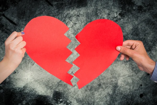 Two hands holding broken heart — Stock Photo, Image