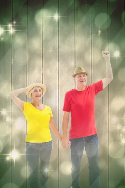 Couple walking and holding hands — Stock Photo, Image