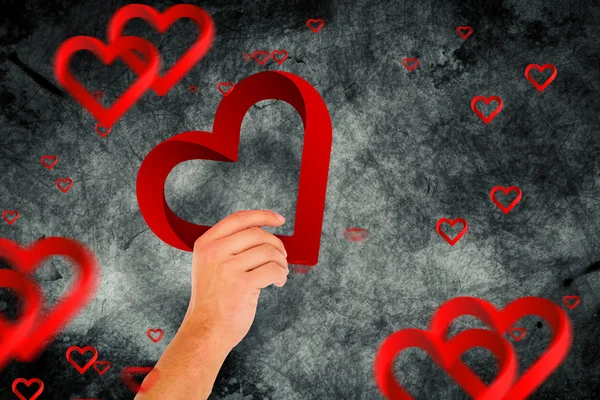 Mano con cuore contro cuore — Foto Stock