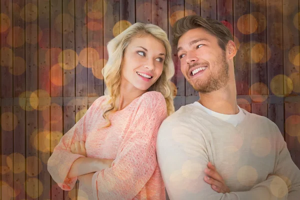 Couple smiling with arms crossed — Stock Photo, Image
