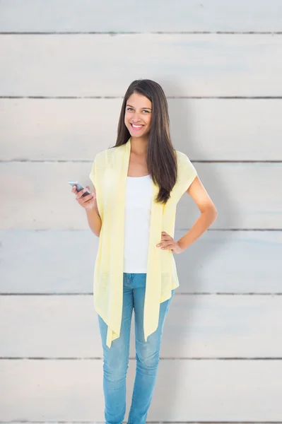 Happy casual woman sending a text — Stock Photo, Image