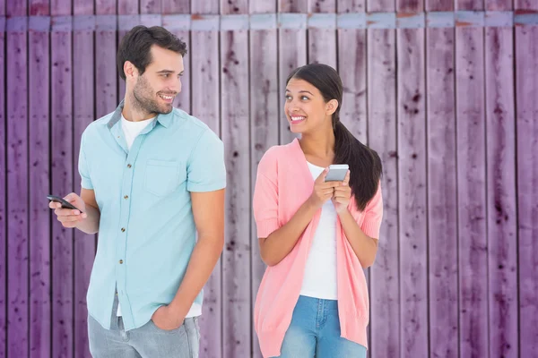 Couple sending text messages — Stock Photo, Image