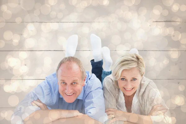 Happy mature couple lying and smiling — Stock Photo, Image