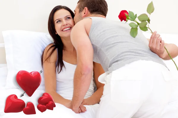 Husband giving a rose and a kiss to wife — Stock Photo, Image