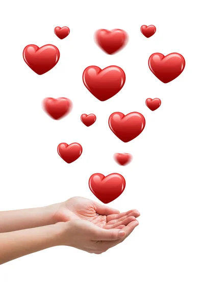 Hands presenting hearts — Stock Photo, Image