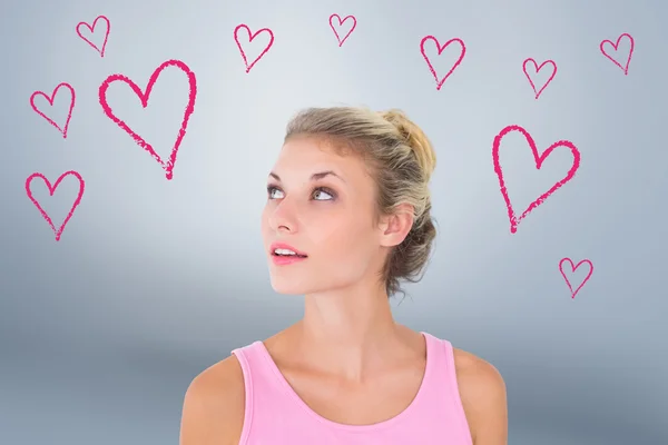 Blonde in pink looking up — Stock Photo, Image