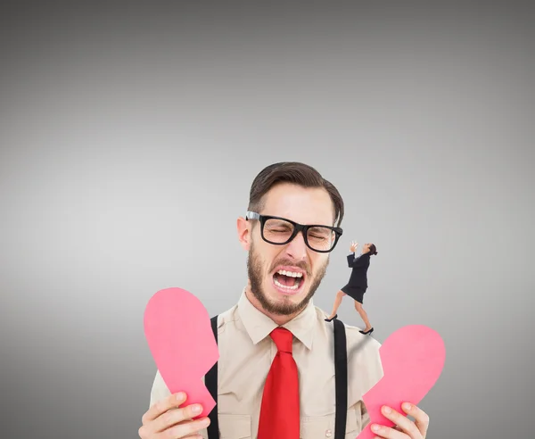 Man with heart and angry businesswoman — Stock Photo, Image