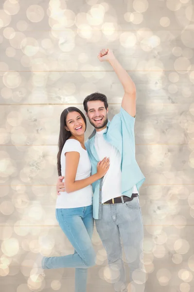 Casual couple cheering at camera — Stock Photo, Image