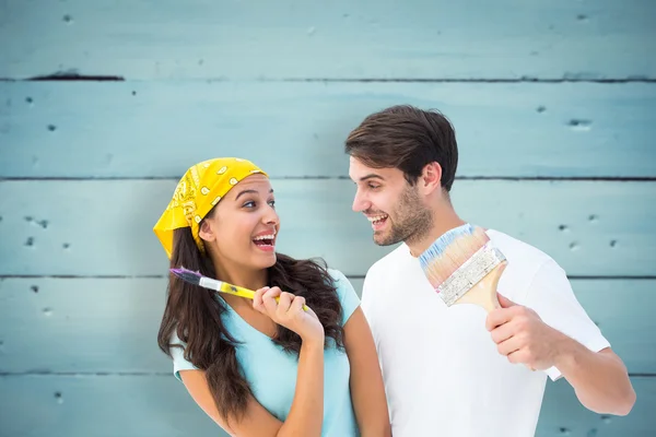 Happy young couple painting together — Stock Photo, Image