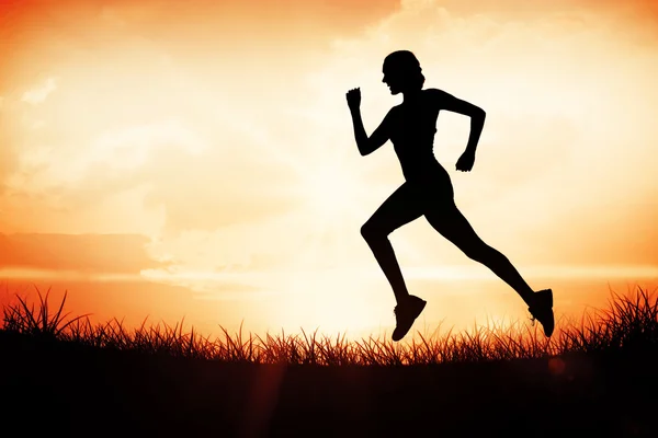 Pretty fit blonde jogging — Stock Photo, Image