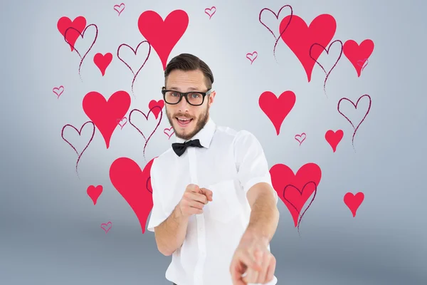 Geeky hipster pointing at camera — Stock Photo, Image