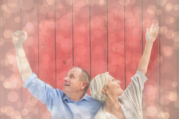 Happy mature couple with hands up — Stock Photo, Image